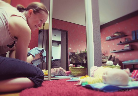 Mom cleaning while baby is on the floor