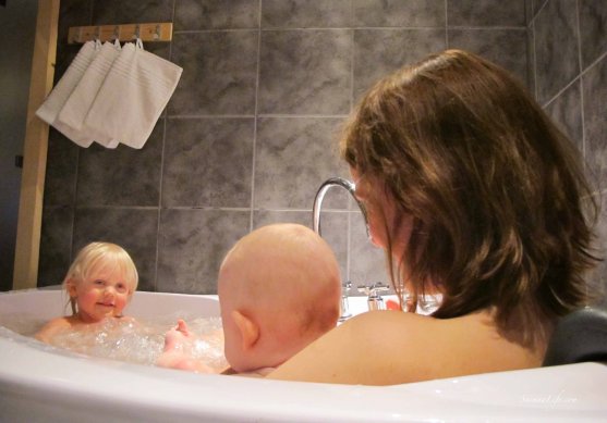 Mother and two daughters in cottage hot tub