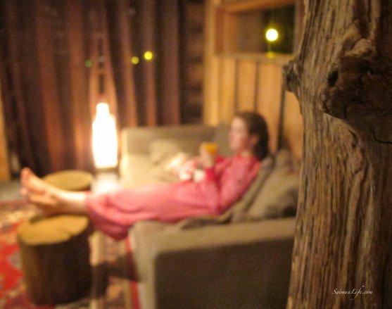 Woman watching tv in cottage old wood in front