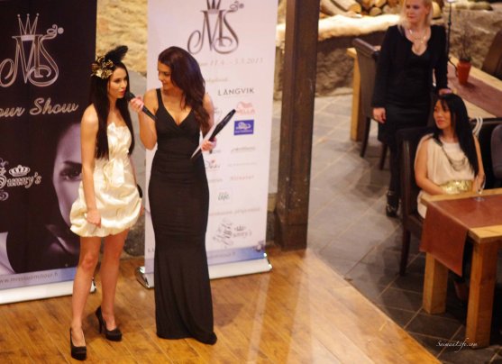 Miss Finland brunette candidate interviewed during tour show in holiday village Jarvisydan