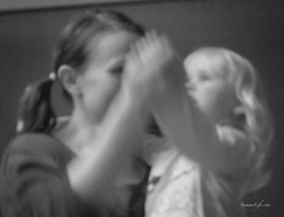 Mother and daughter dancing together black and white picture