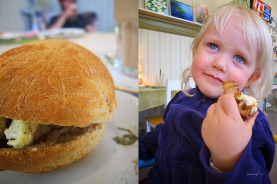 homemade herb butter bread and little girl eating