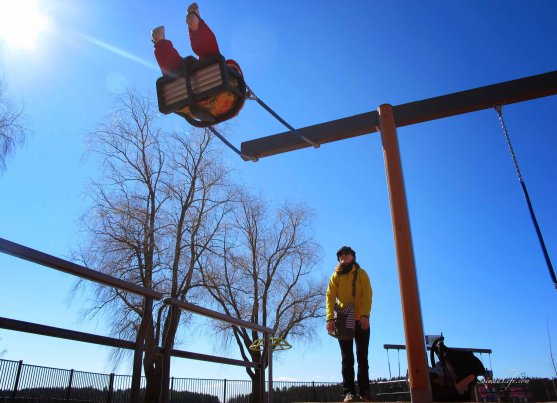 girl swinging playground