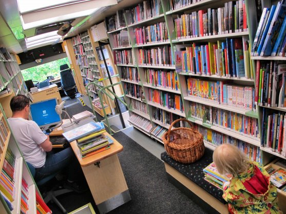 mother-and-children-visiting-library-car-2