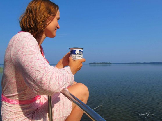 woman-having-morning-coffee-by-lake-5