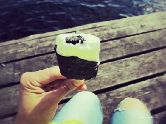 woman-eating-ice-cream-by-lake-1