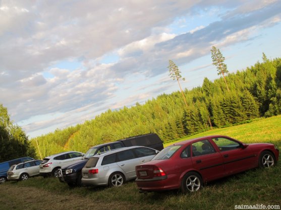 cars-on-field-in-finnish-countryside