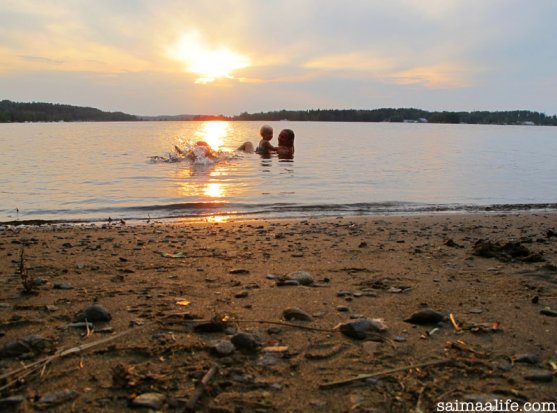 mother-and-children-swimming-on-finnish-lake