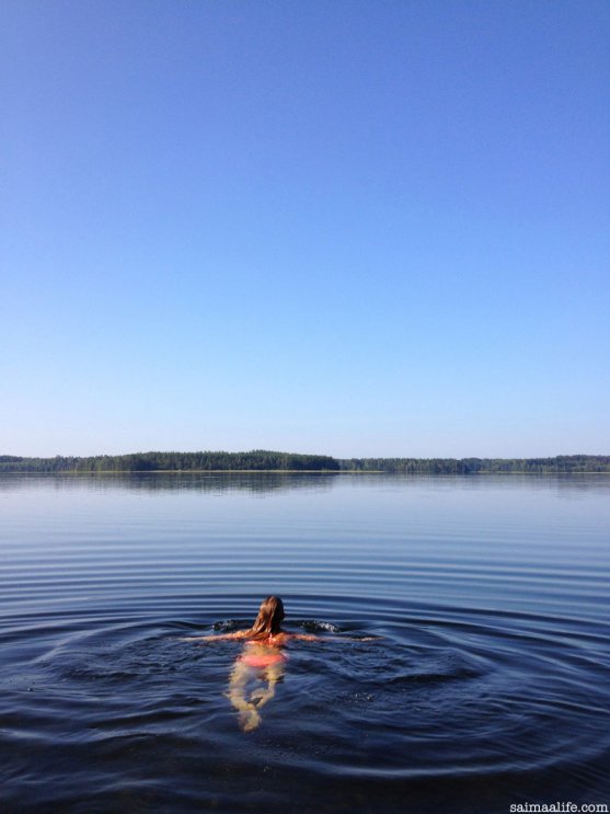 mother-swimming-alone-in-lake-in-summer-morning