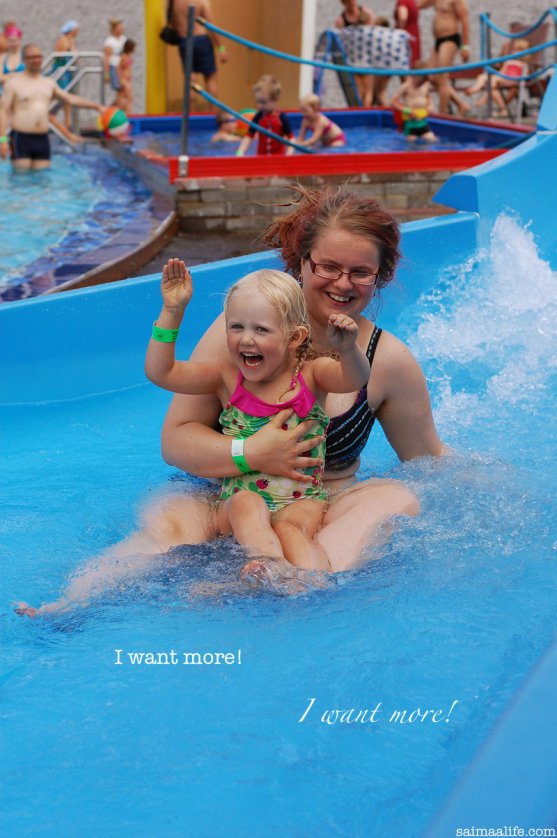 child-and-godparent-sliding-in-waterslide