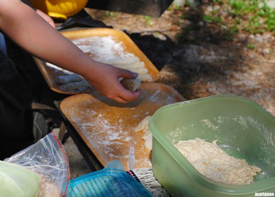 grandmother-making-campfirebread-rolls-on-island