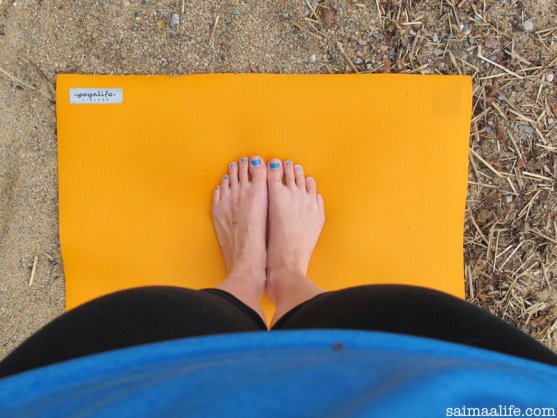 woman-practising-yoga-on-beach