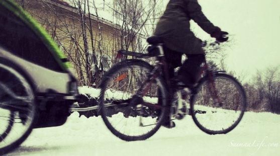 working-mother-taking-children-to-daycare-with-bicycle