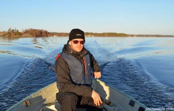 father-driving-boat-on-lake