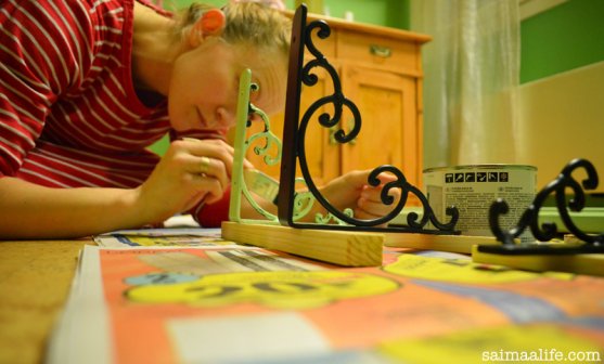 mother-paints-book-shelf-while-children-are-sleeping