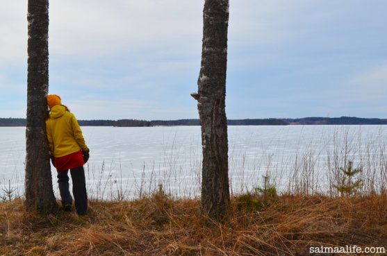 woman-by-lake-puruvesi-in-finland-in-spring