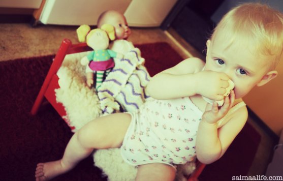 child-eating-her-snack-in-kitchen