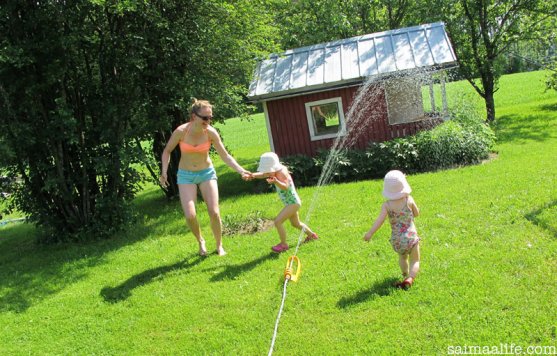 mother-and-daughters-playing-together-in-garden