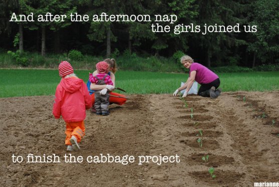 mother-grandmother-and-grandchildren-in-vegetable-garden-together