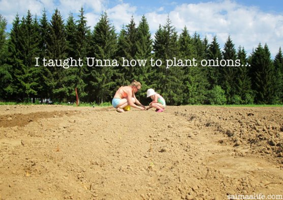 mother-teaching-her-daughter-to-plant-vegetable-garden