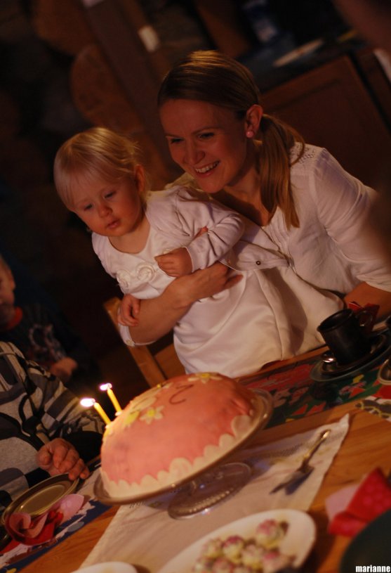 child-blowing-candles-from-birthday-cake