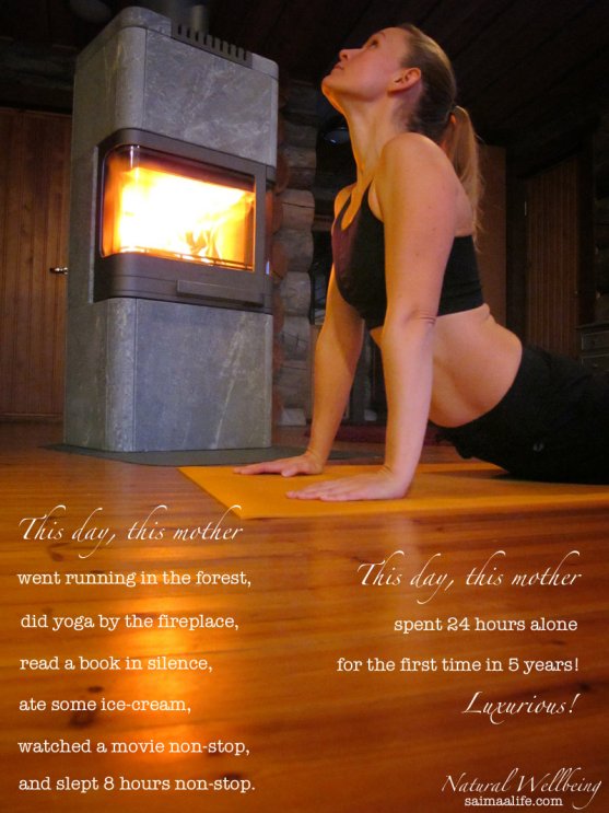 mother-practicing-yoga-by-the-fireplace-at-home