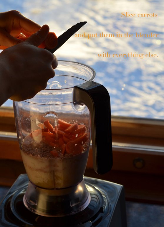 mother-making-carrot-pineapple-smoothie-with-blender