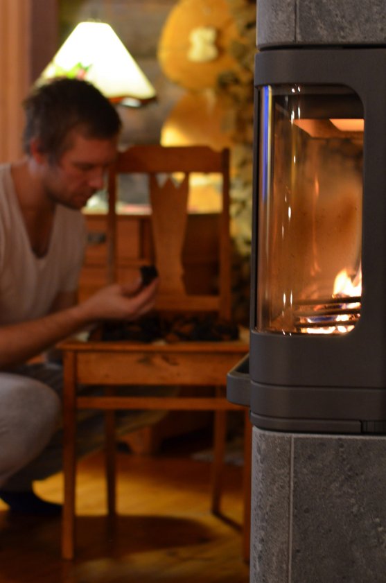 man-drying-chaga-mushroom-by-the-fireplace