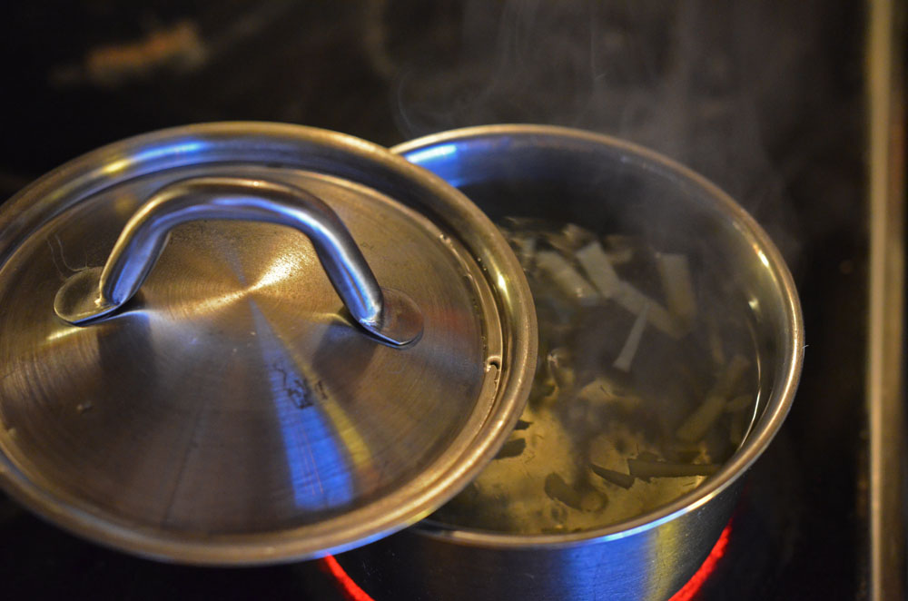 boiling water with fresh ginger 