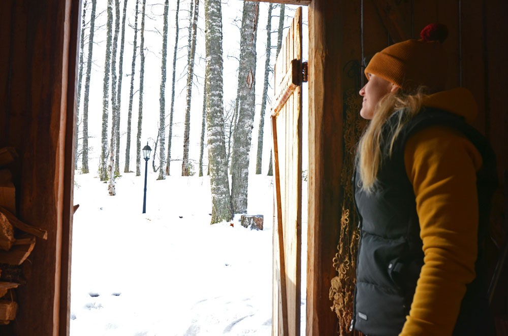 slower-rhythm-woman-watching-trees-outdoors