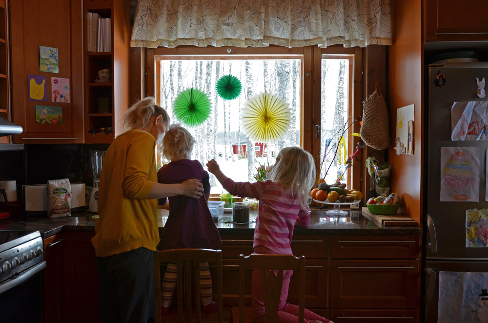 family-planting-pea-shoot-seeds-in-the-kitchen