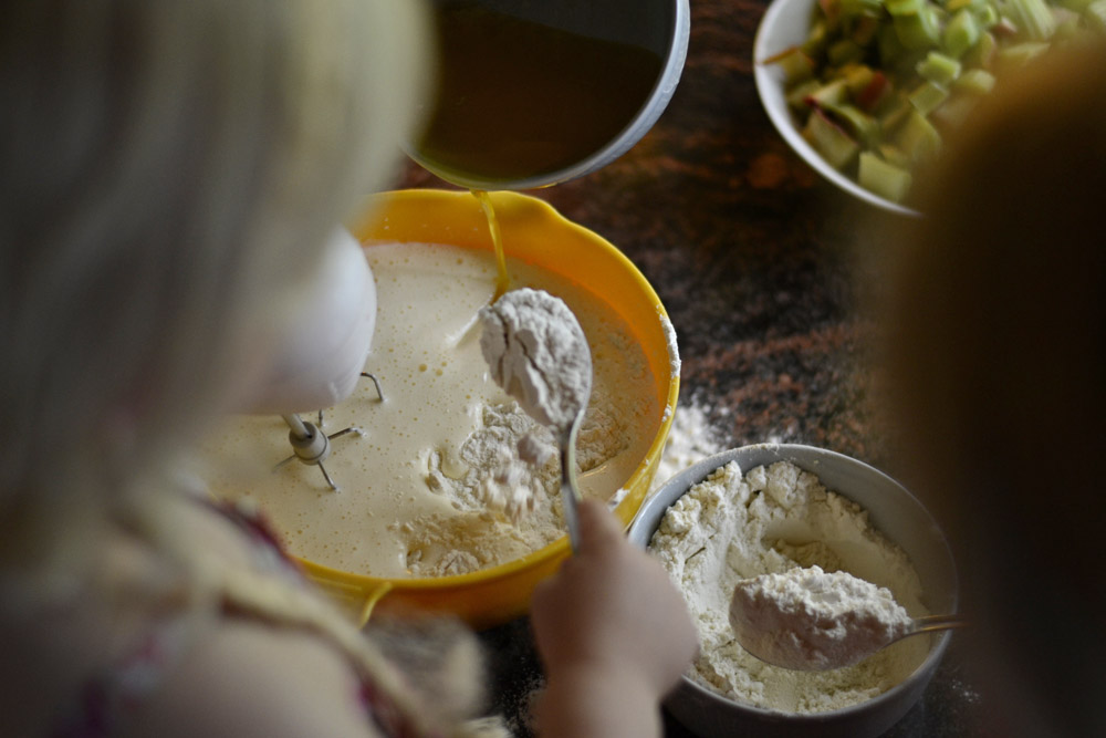 adding-butter-and-flour-to-rhubarb-pie