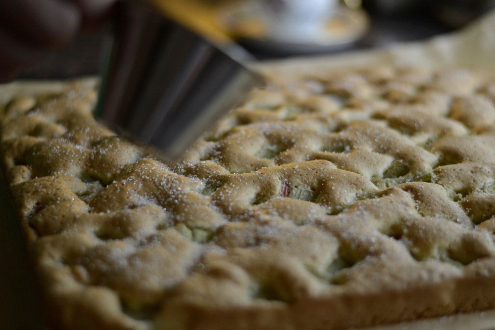 putting-sugar-on-top-of-rhubarb-pie