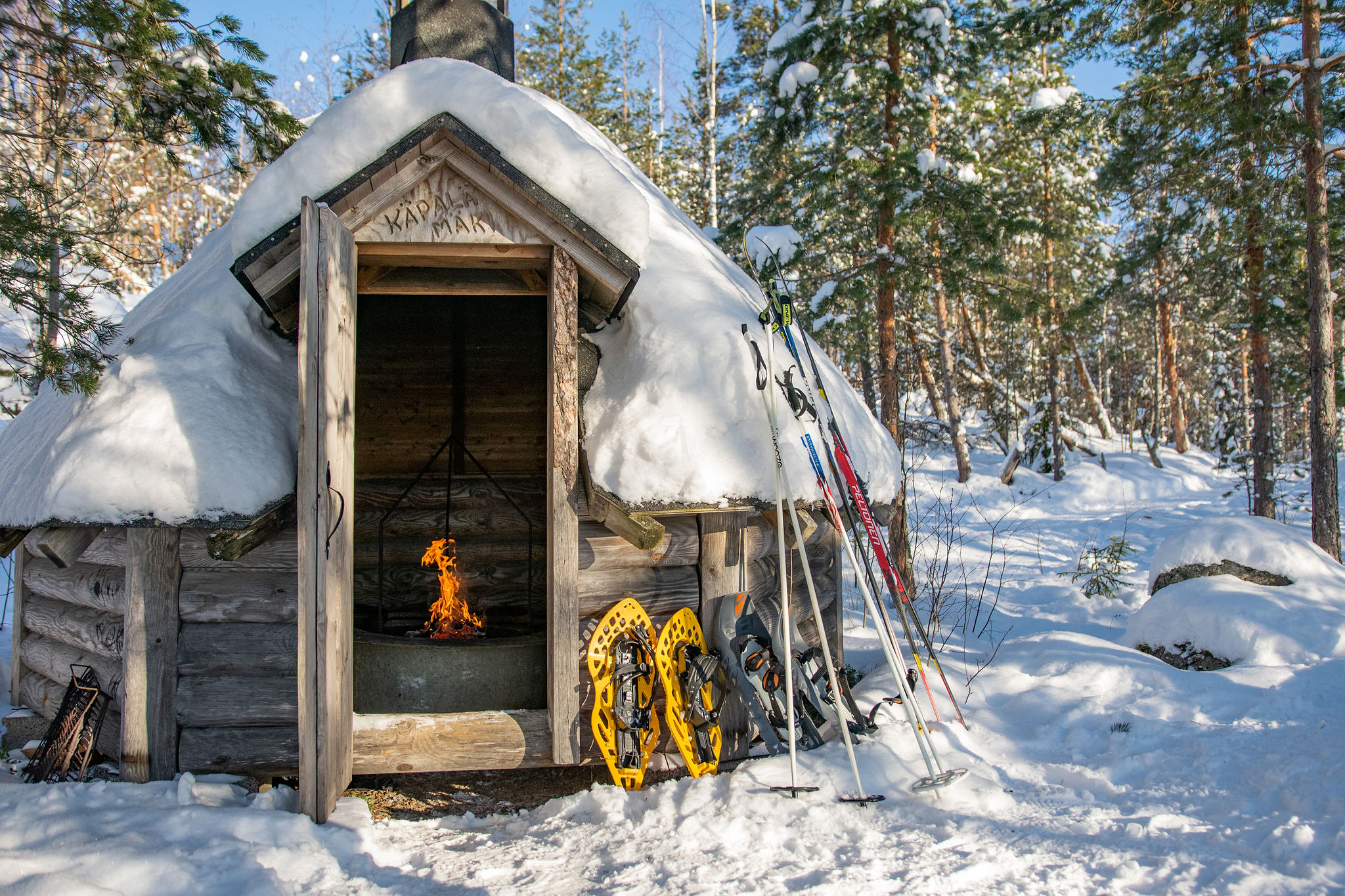 Winter campfire picnic over cross country skiing and snowshoeing 