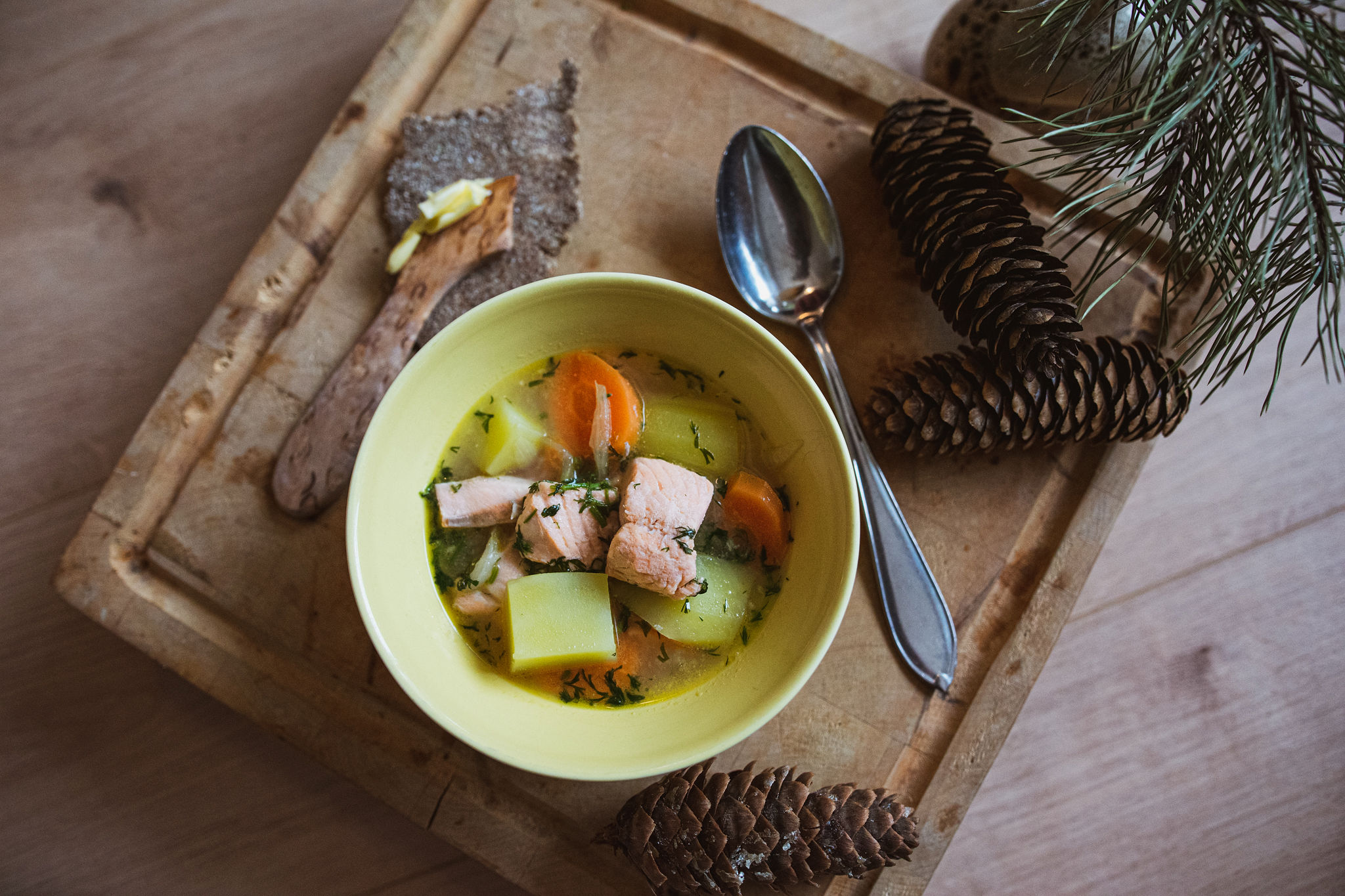 Paula's traditional salmon soup recipe with Finnish homemade rye cracker