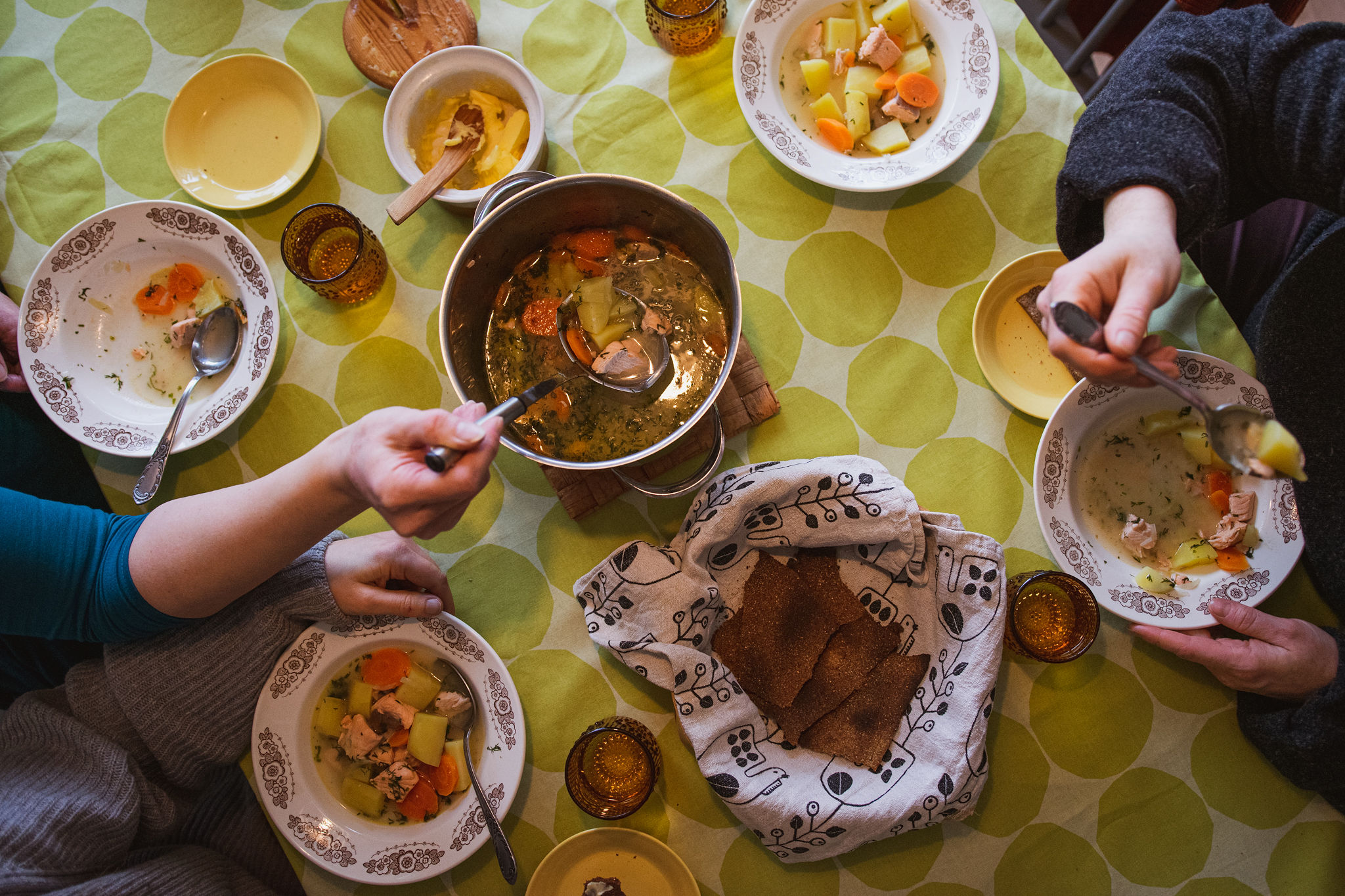 saimaaLife ladies enjoying traditional Finnish salmon soup with rye cracker