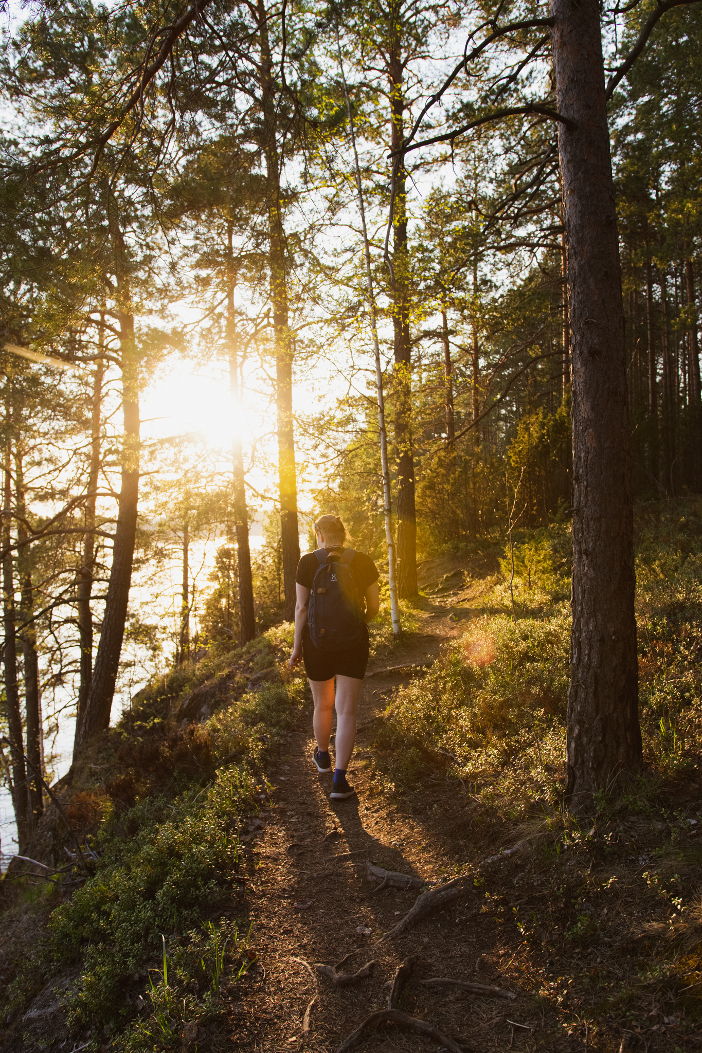 Woman walking in the spring nature in Saimaa, Finland