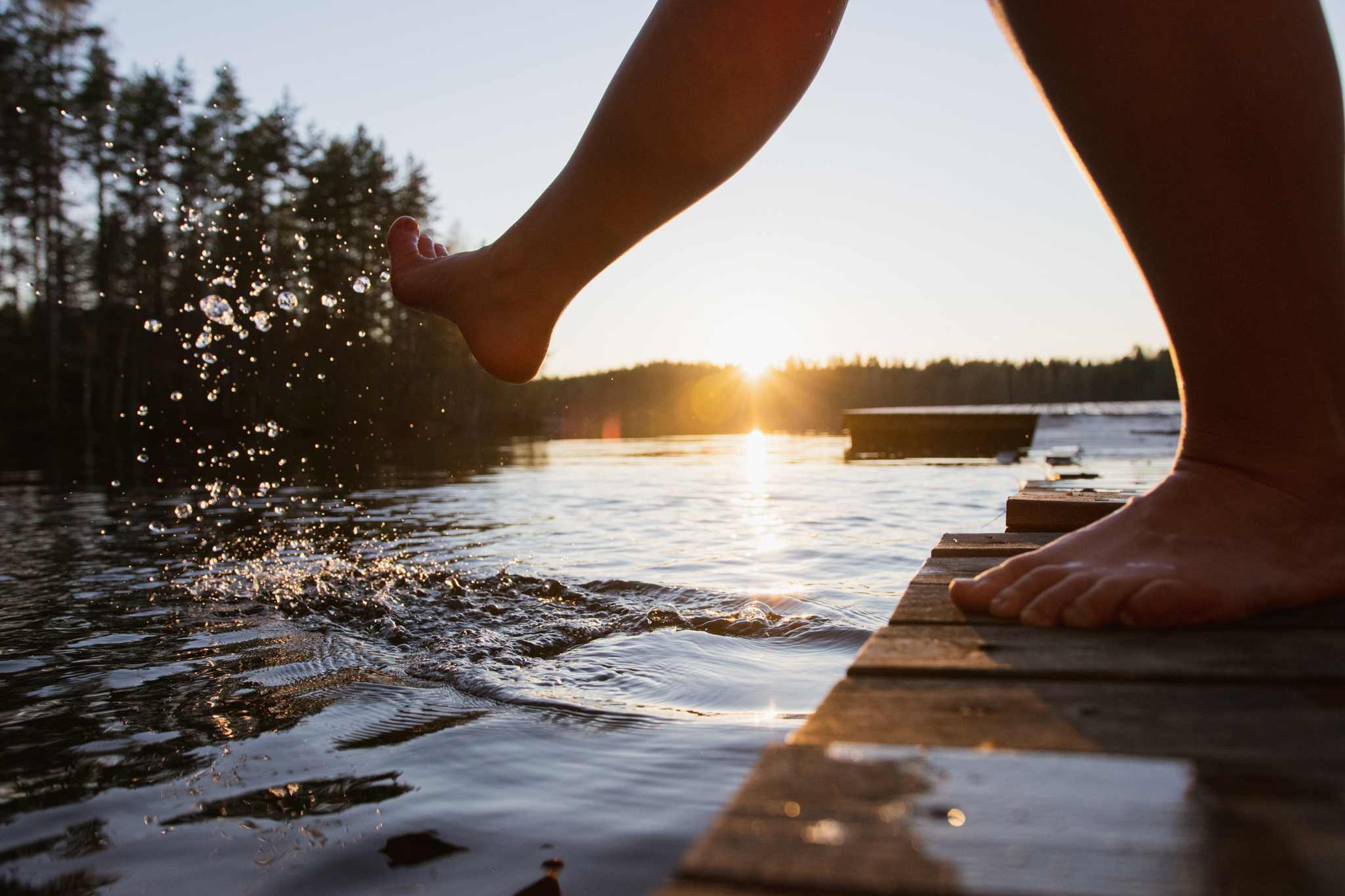 Finnish summer ways to connect with nature and yourself by looking at the sunset by the water