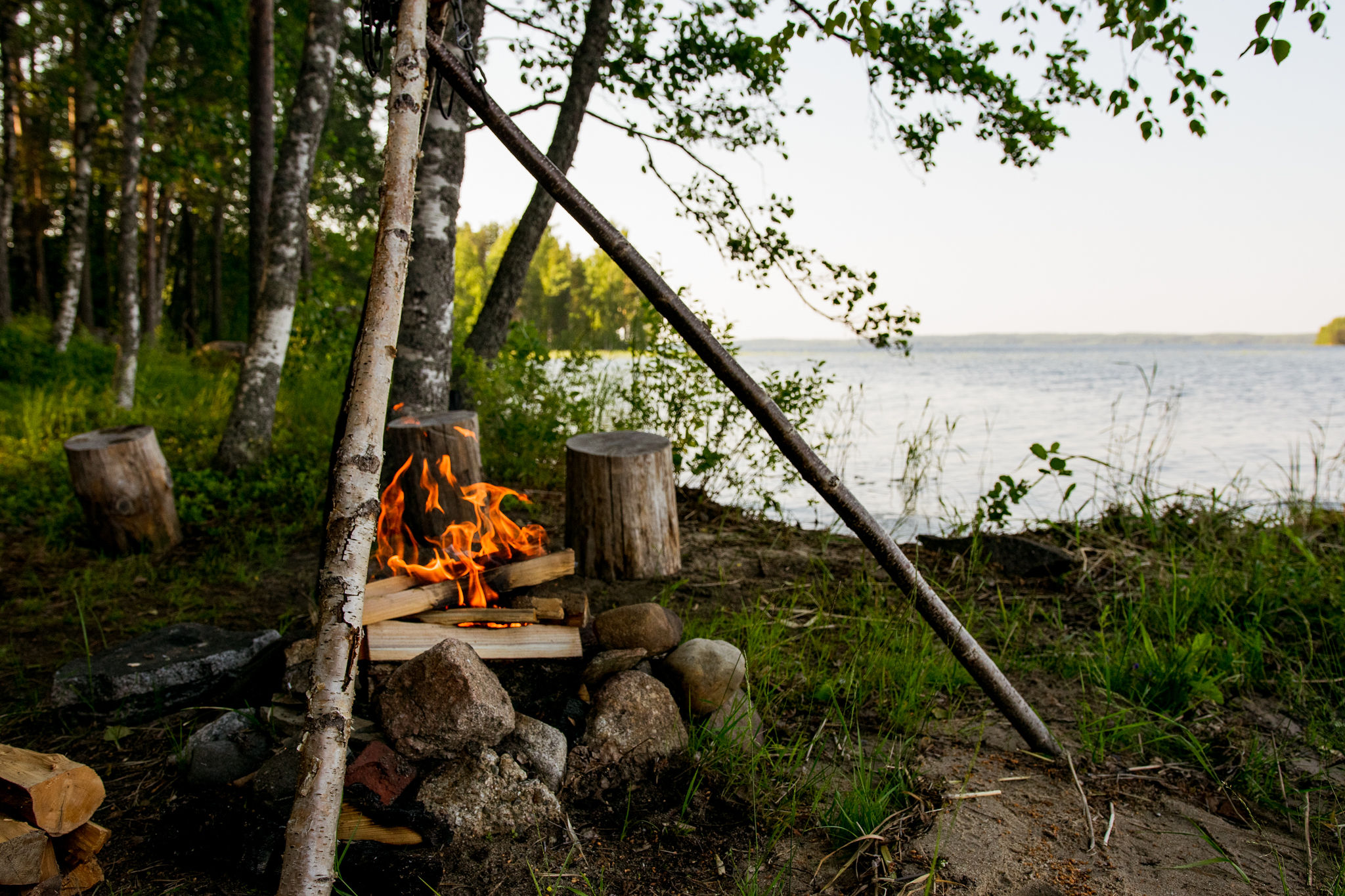 lakeside summer campfire in saimaa, finland