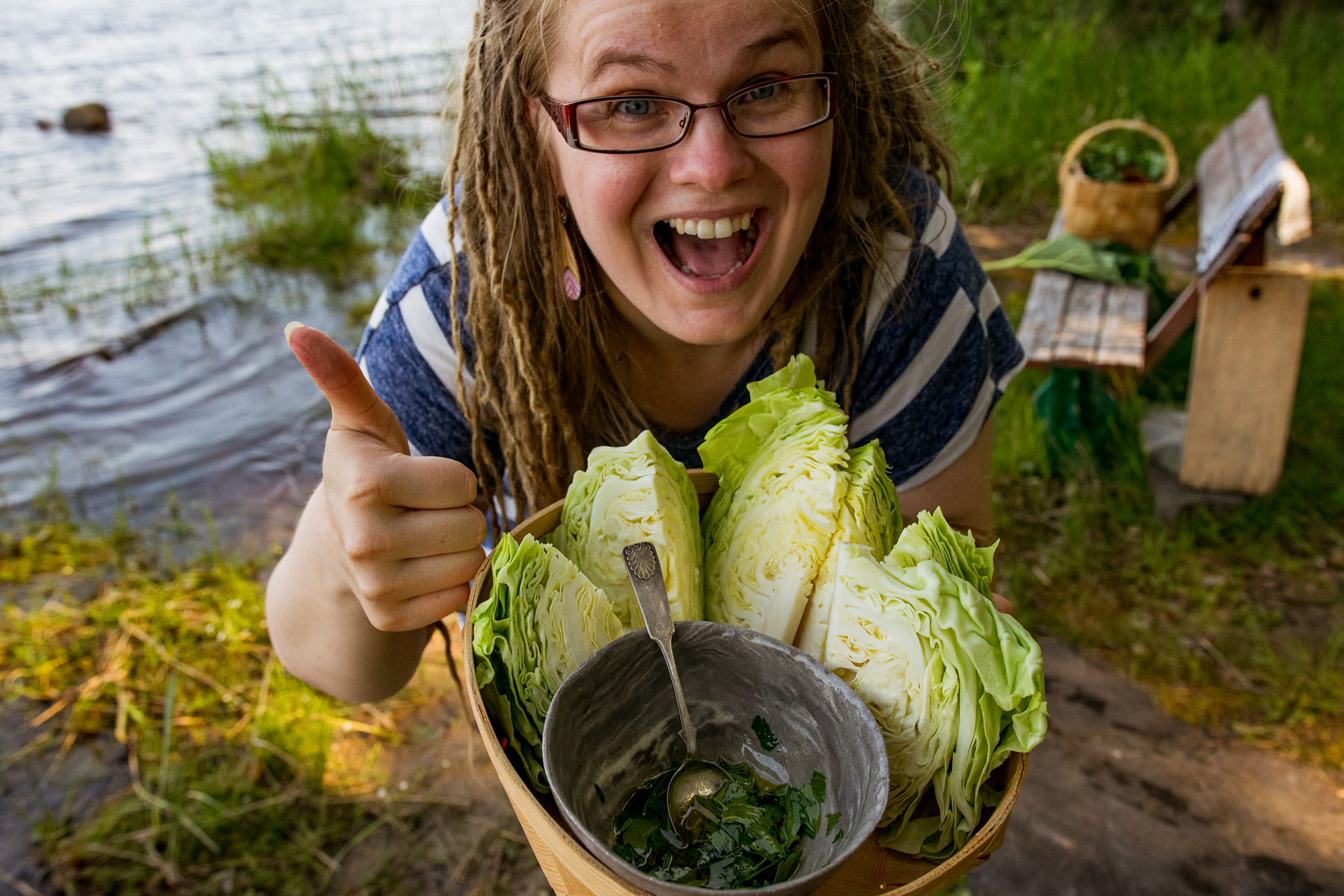 Marianne carrying cabbage into a grill