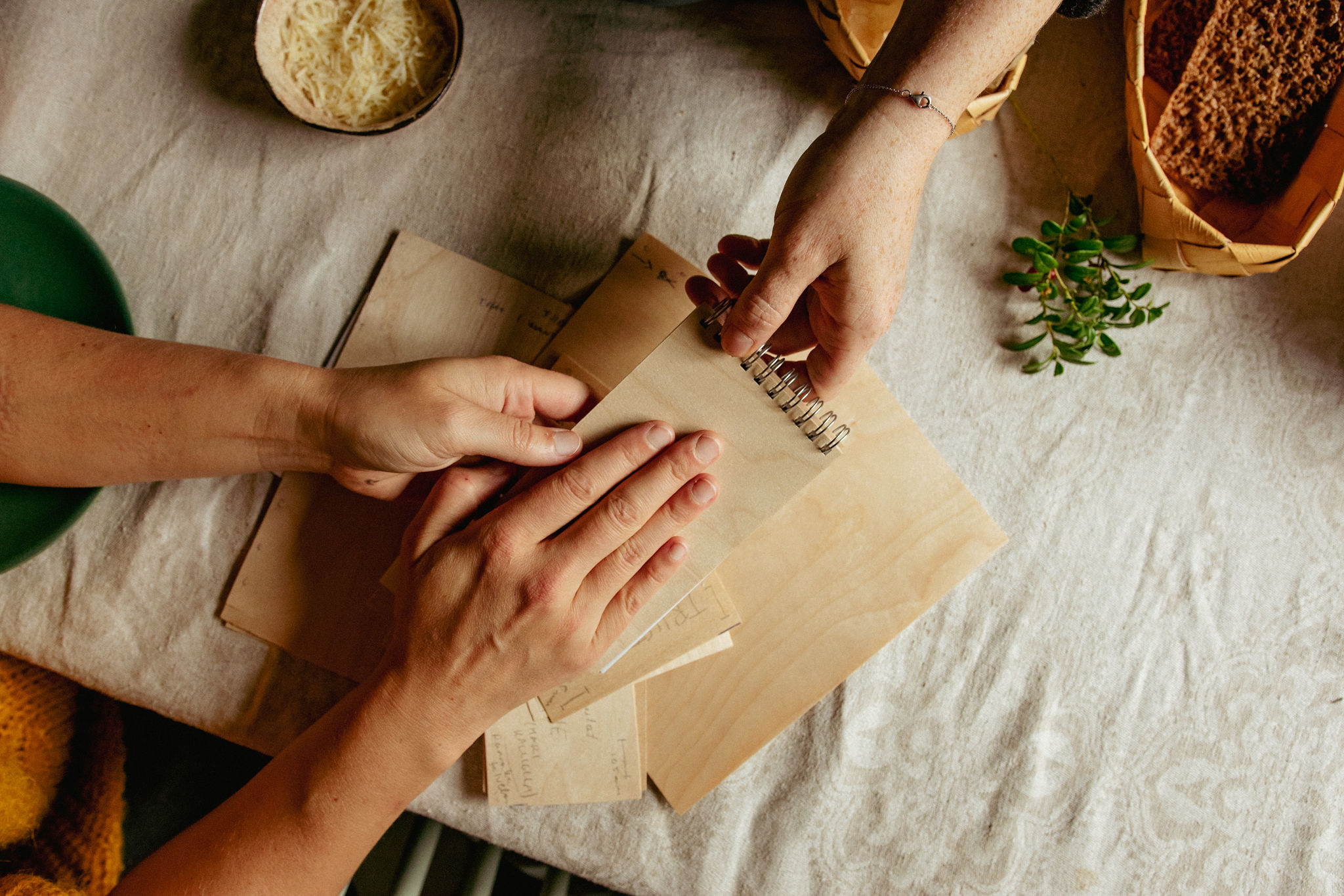 Women touching Finnish plywood items and wood materials