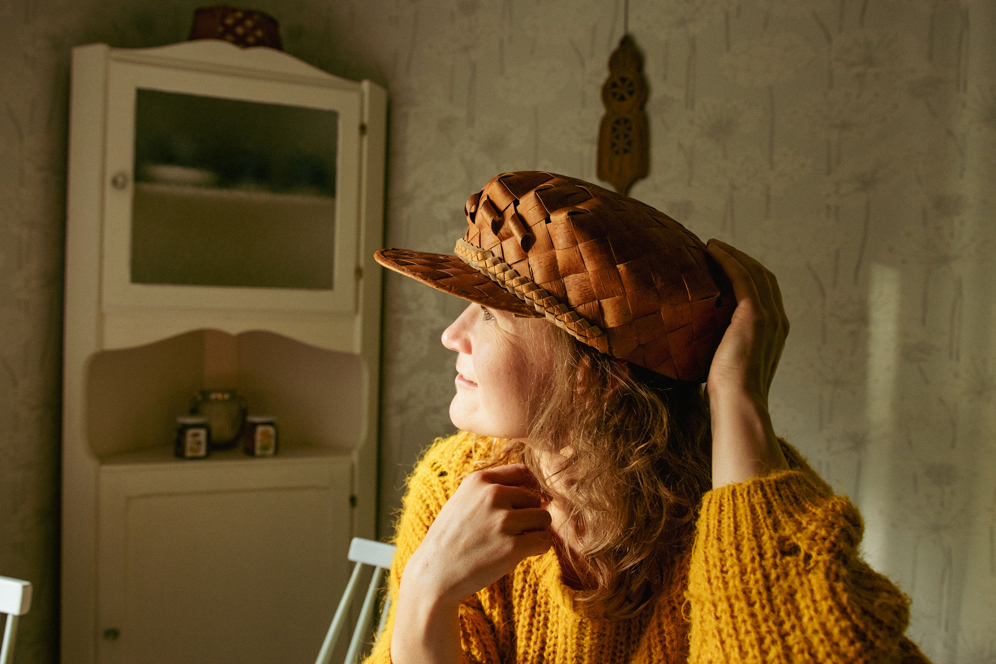Mari saimaaLife with her handmade birch bark hat made by Kaija Karri