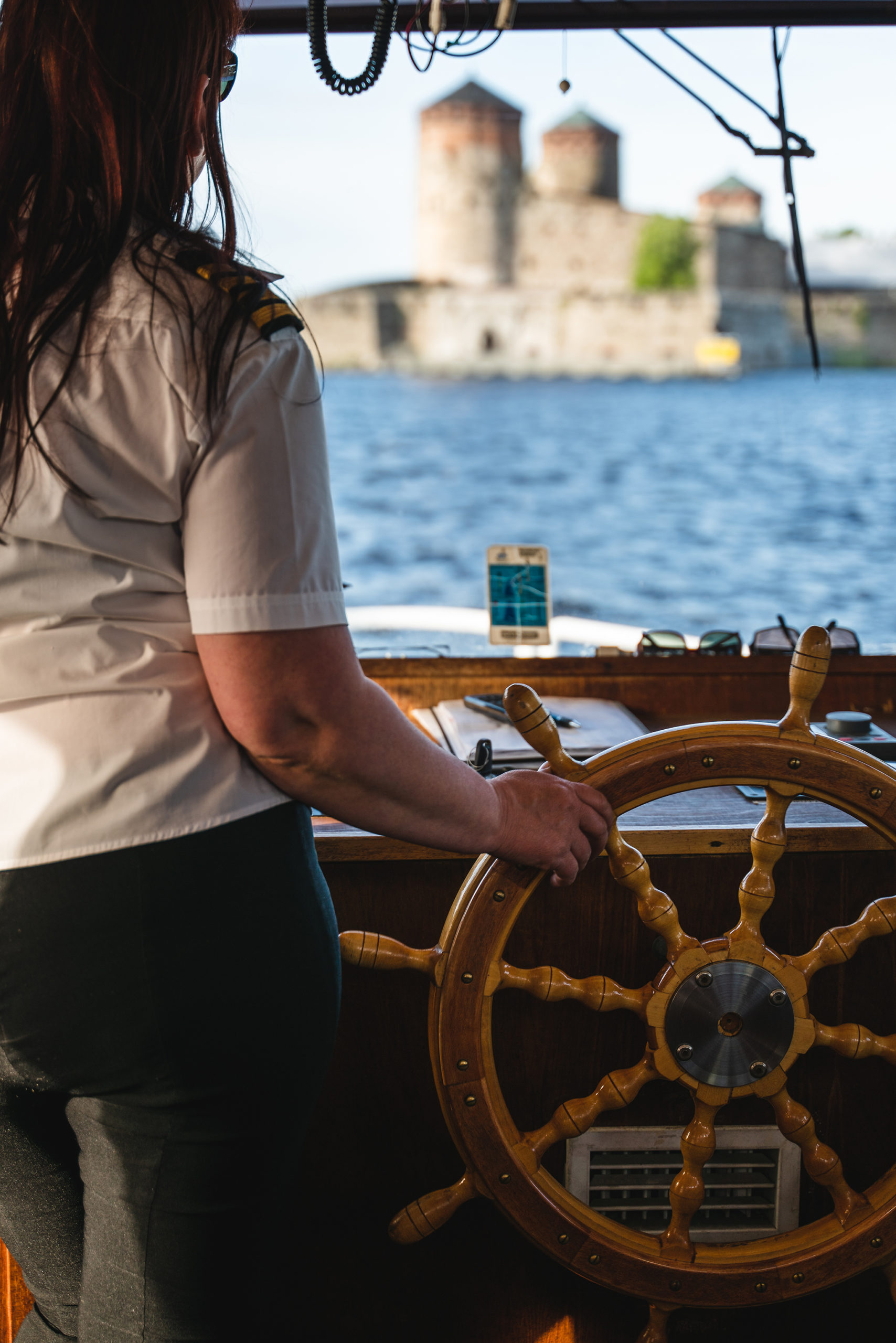 Captain Piia navigating Savonlinna City Sightseeing Cruise