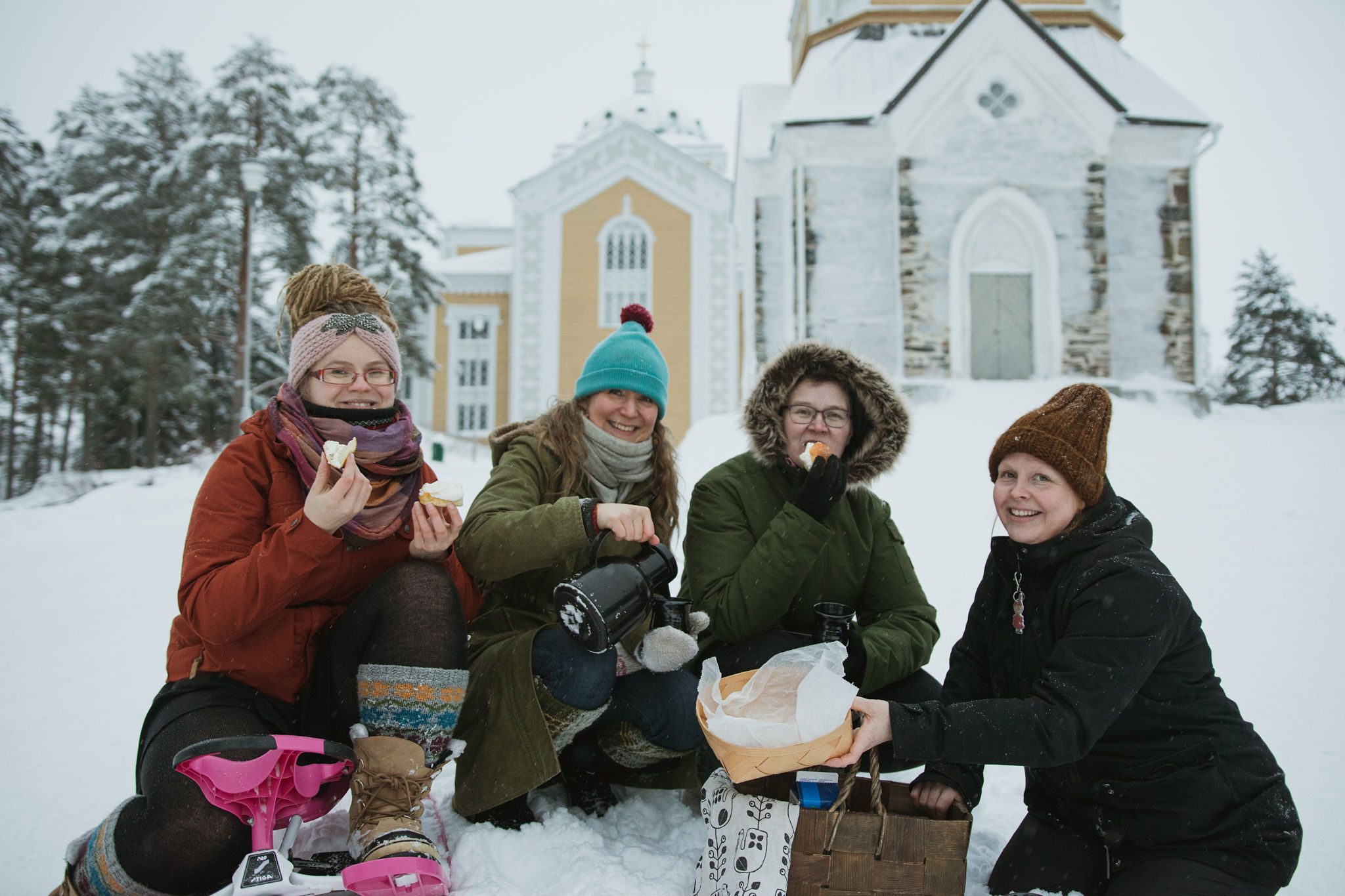 Finnish women having winter bun picnic by Kerimäki church in Finland